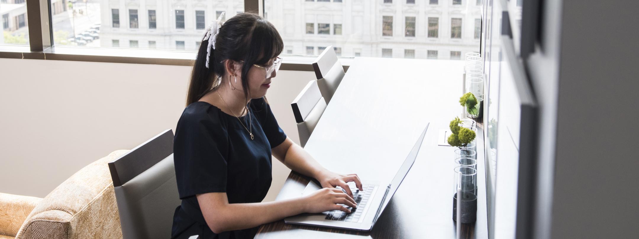 A female accounting student in a downtown office