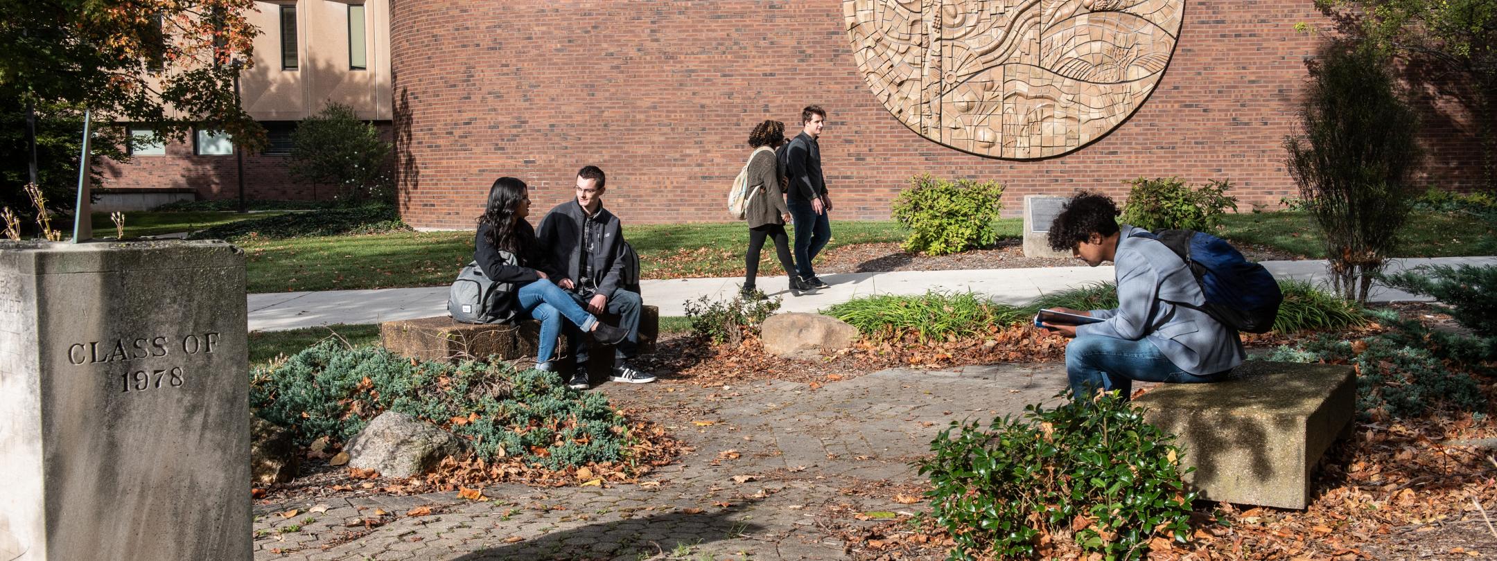 Students walking and relaxing in the geogardens.