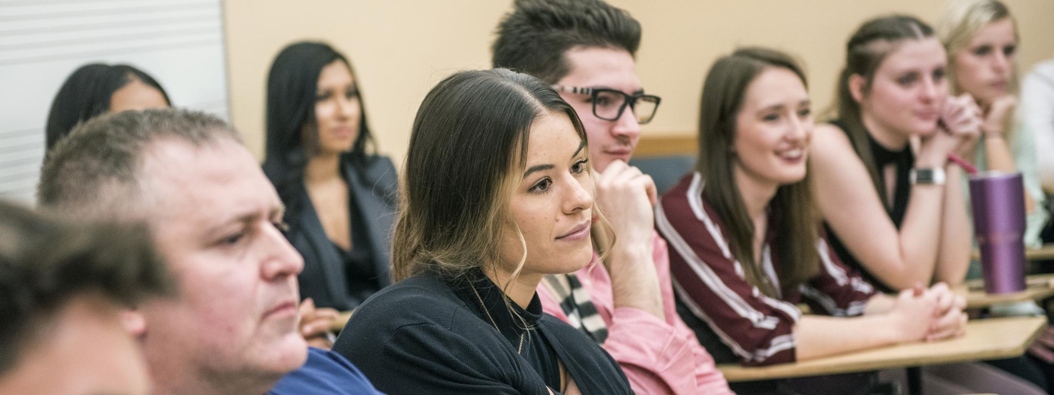 An MBA class listens to a a guest speaker