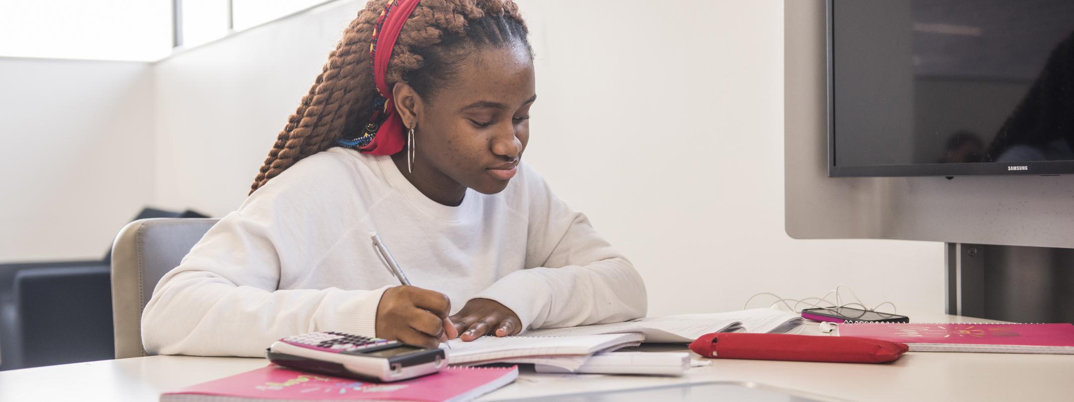 Student studying her class notes.