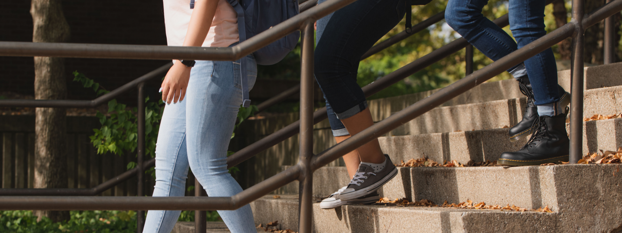 two people walking down stairs