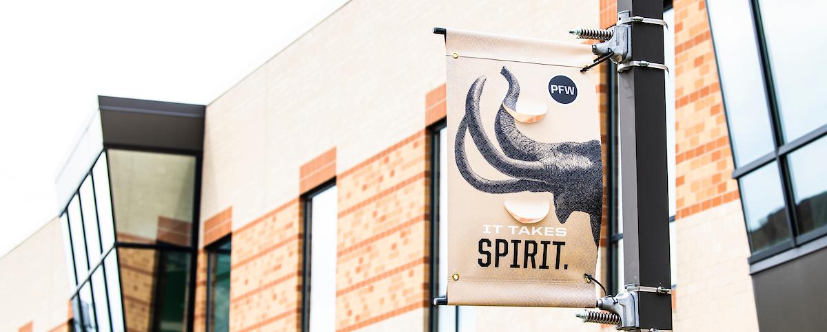 It takes spirit pole banner on campus.