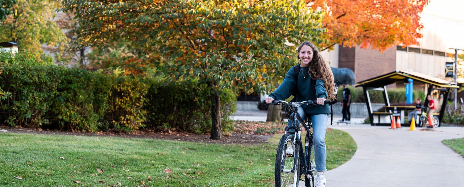 Student riding bike