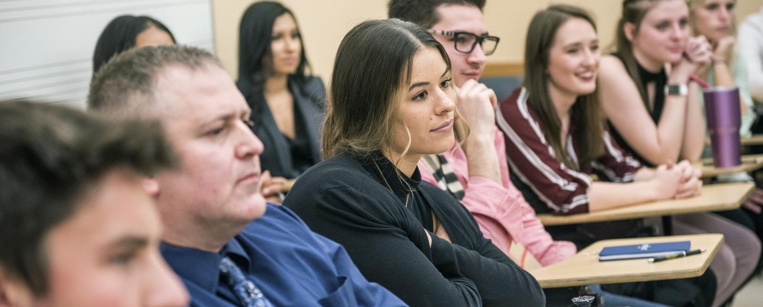 An MBA class listens to a a guest speaker