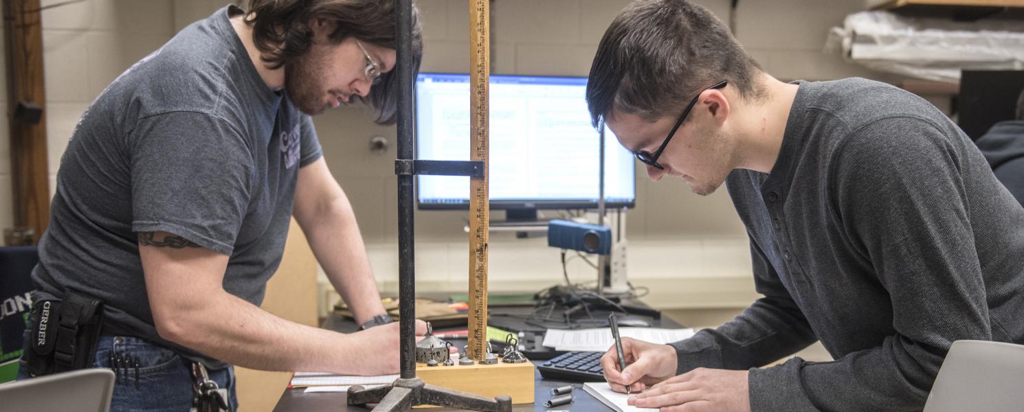 Physics student working on a lab experiment.