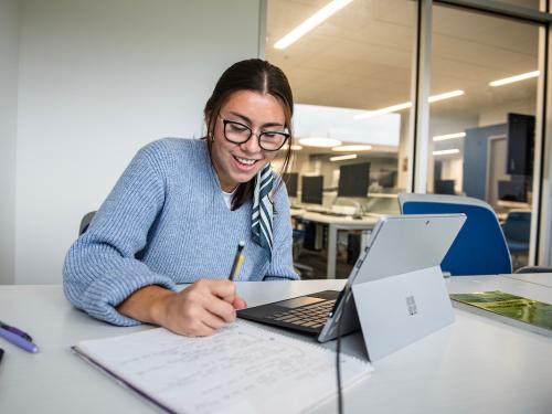 A student studies in the library.