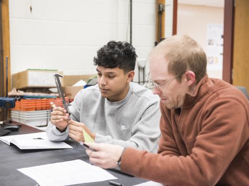 Physics student working on a lab experiment.