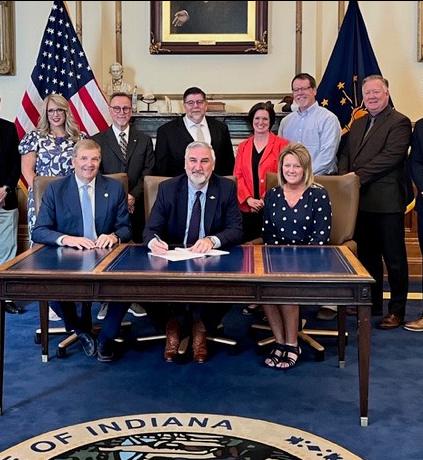 Gov. Eric Holcomb is signing a bill into law.