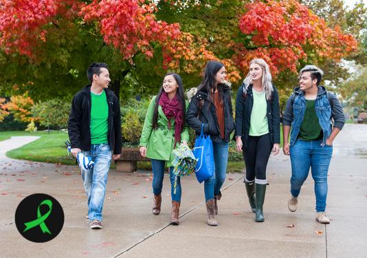 Students wearing green in the Fall