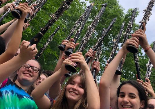 group holding clarinets