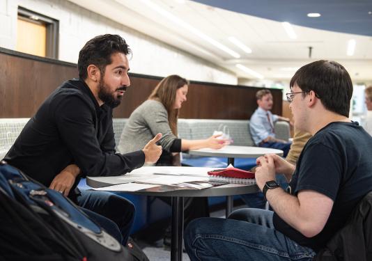 Students working on interview preparation during the career fair.