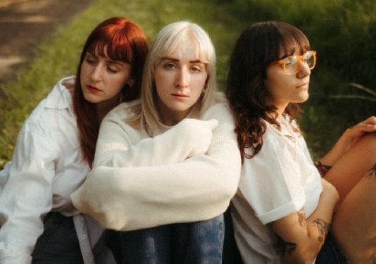 three women in a feild