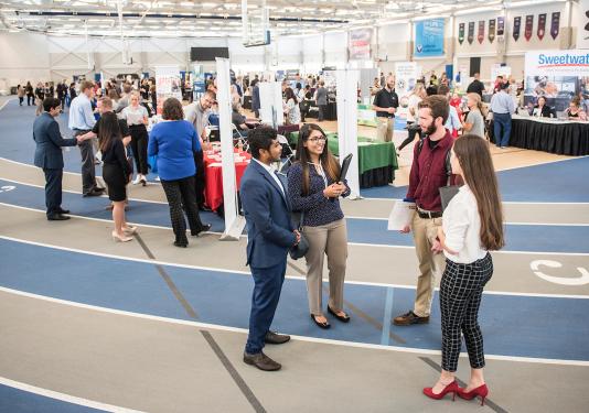 Students collecting information on careers at the career fair.