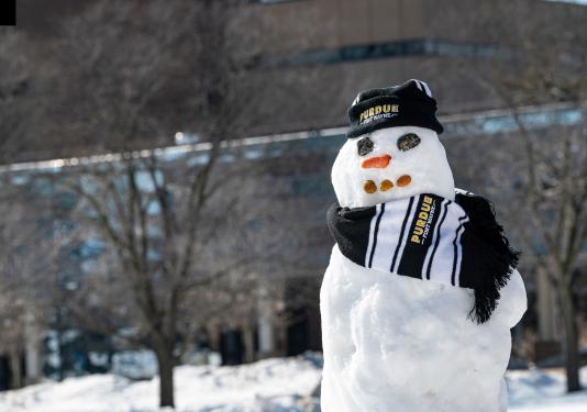 Photo of a snowman dressed in Purdue garb.