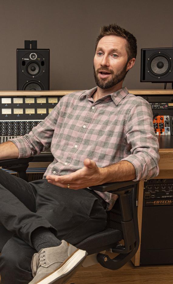 John Buteyn is sitting in a recording studio