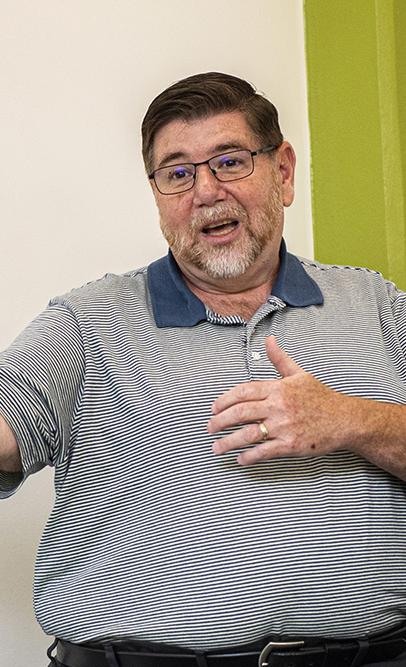 Brad Oliver speaks in a classroom