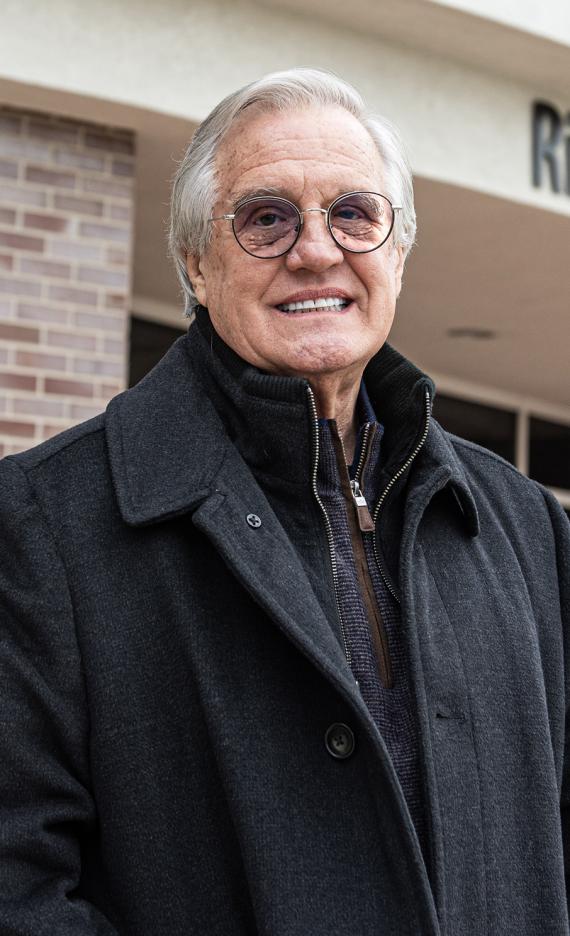 Portrait of Jim McHann outside the Doermer School of Business Building