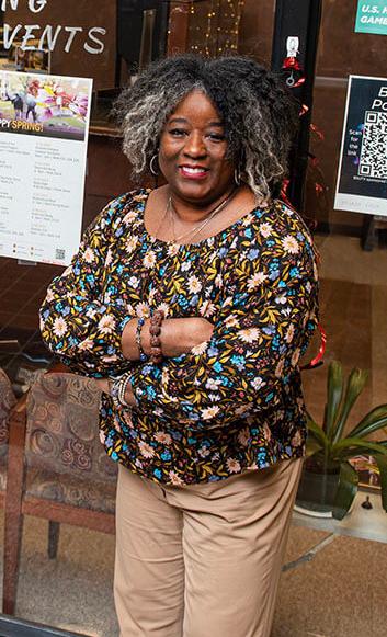 Rhonda Meriwether is standing in front of the Multicultural Center office