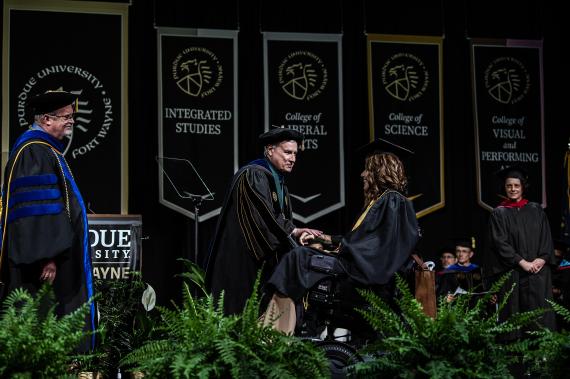 Student walking across the stage.