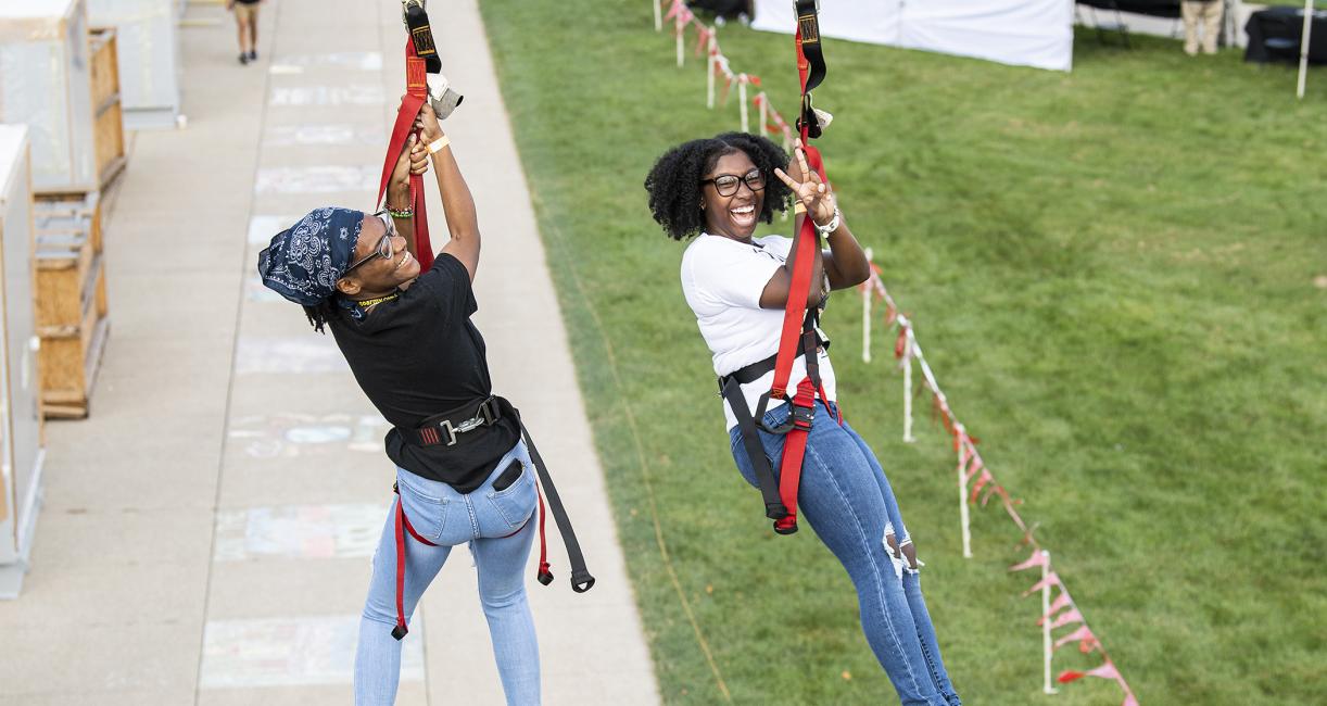 And the race is on for two PFW students ziplining at the annual Picnic on the Lawn on Sept. 7