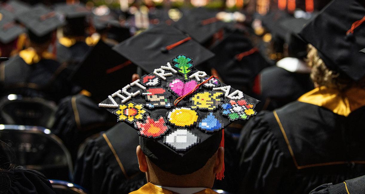 A graduate with a decorated cap.