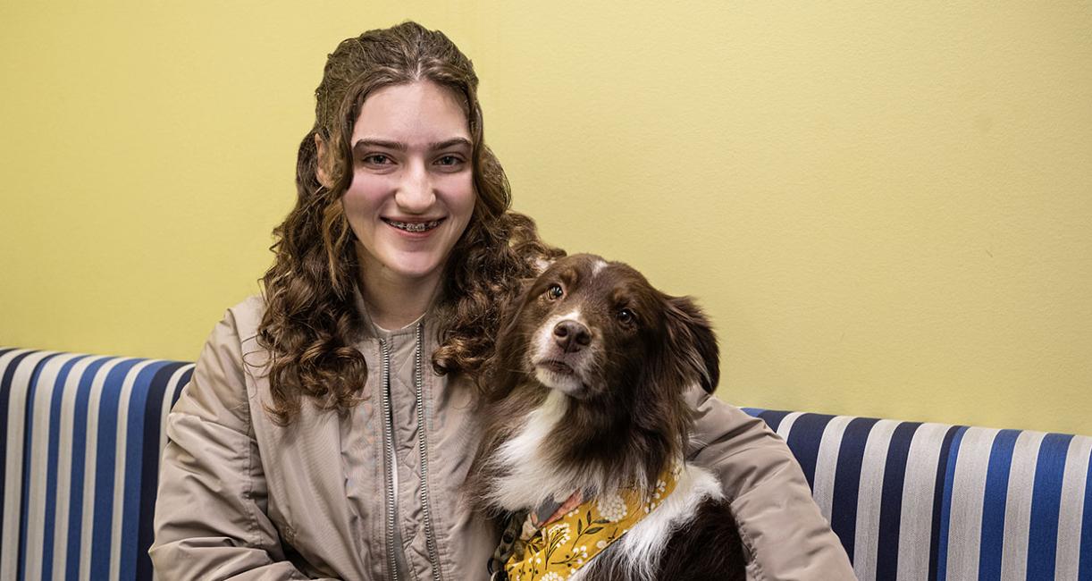 Emily Wentland and her therapy dog, Gunner.