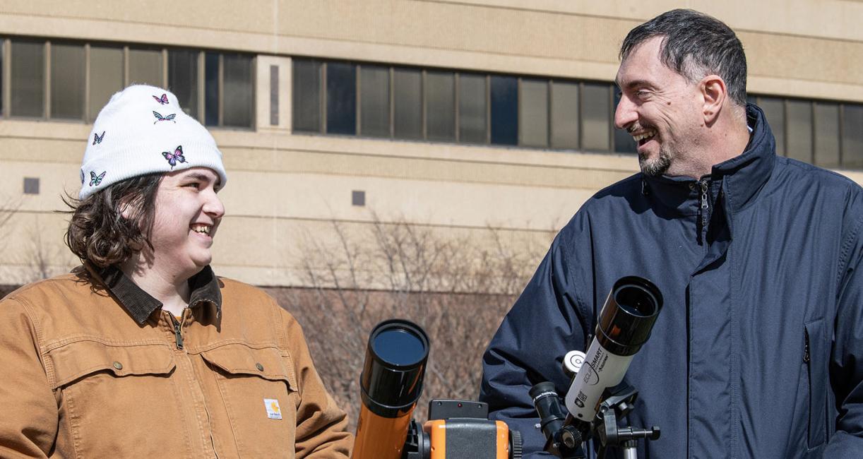 Eugenio Ursino, assistant professor of physics (right), with Finn Finney (left), a sophomore majoring in physics