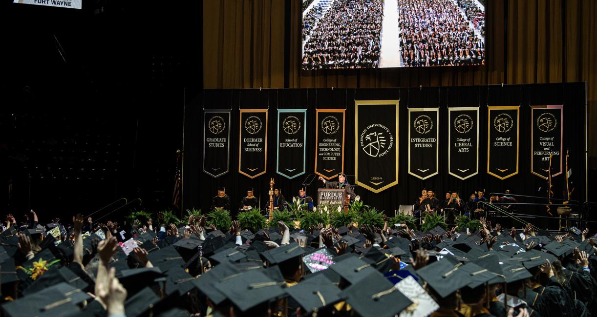 Graduating students in cap and gowns.