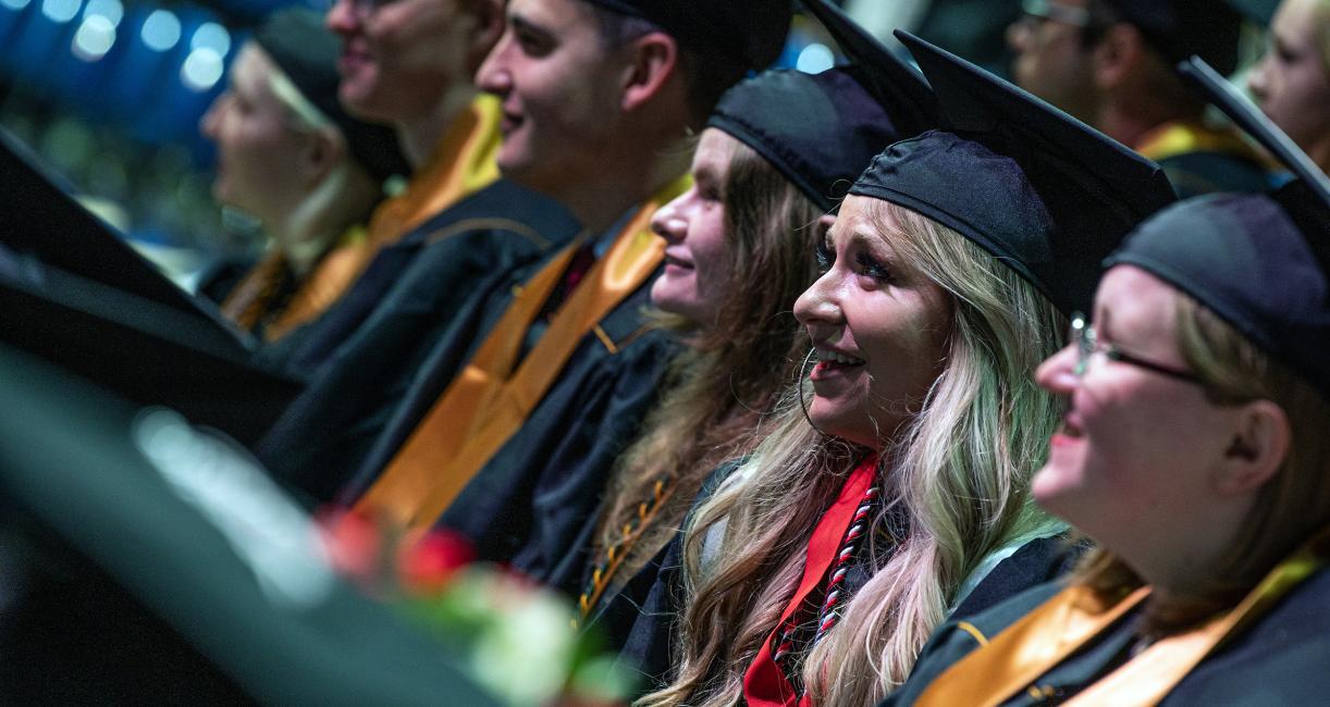 Students listen to the opening speeches of commencement.