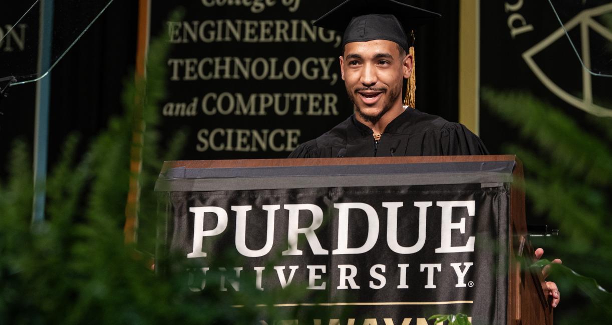 Student speaker at the podium for commencement.