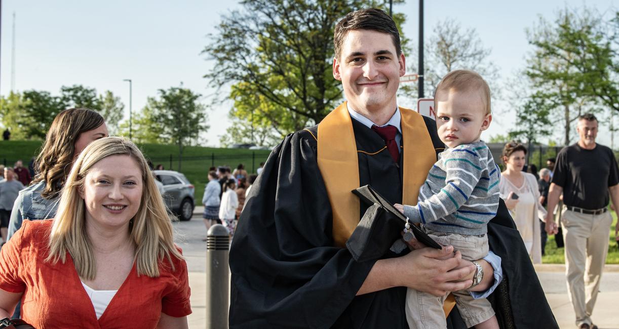 Graduating student with family.