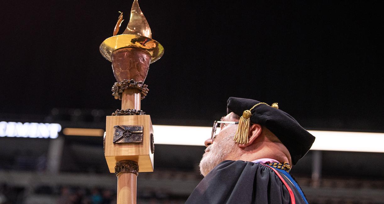 Commencement mace being carried in.