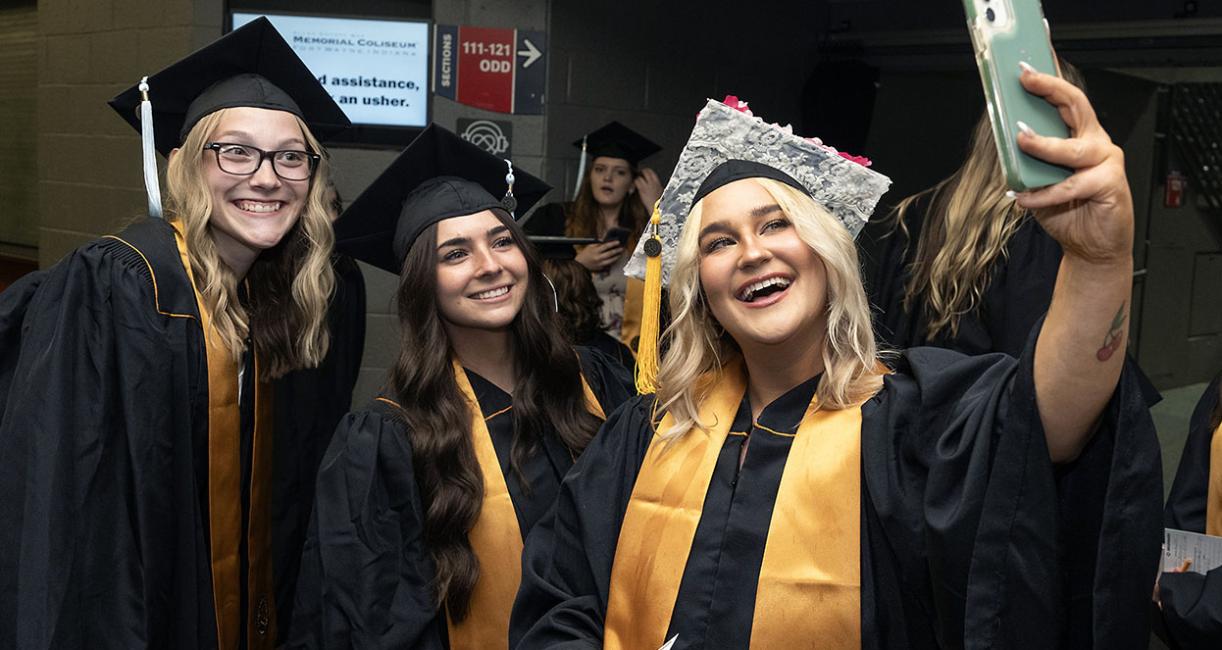 Smiling students at commencement