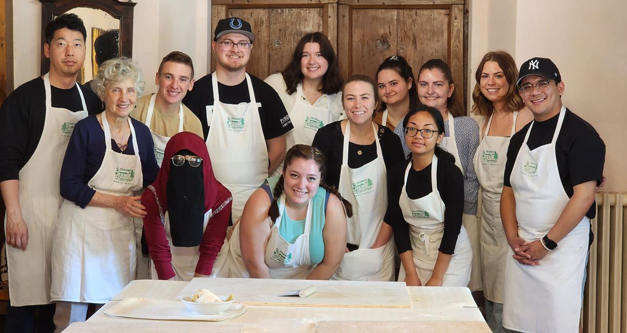 Students are taking a cooking class in Italy