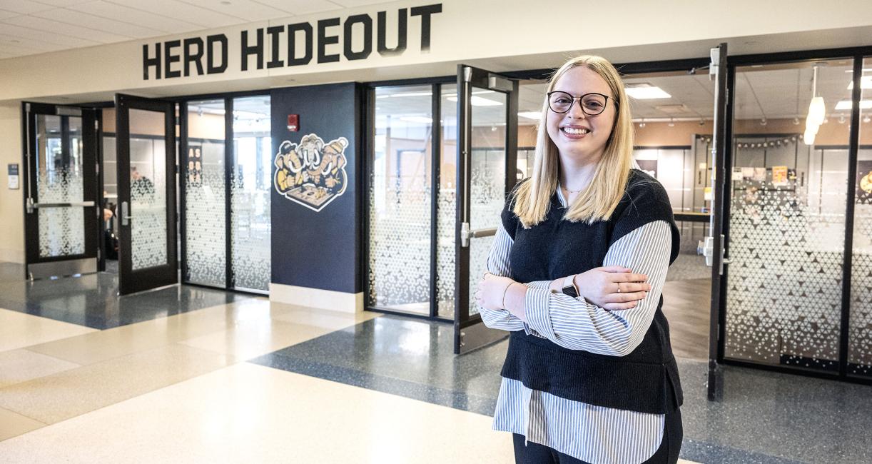 Mikayla Haggarty standing outside of the Herd Hideout