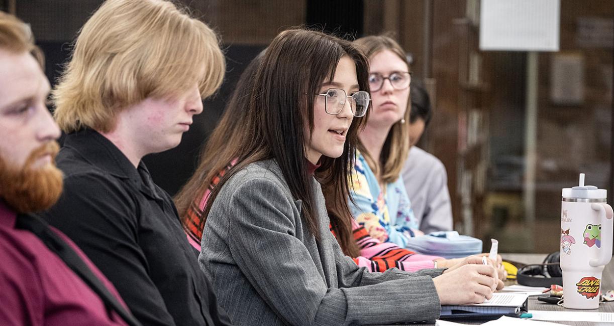 A student is questioning a witness at a mock trial